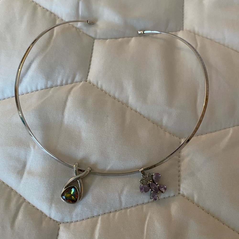 Silver choker style necklace with 2 different pendants.